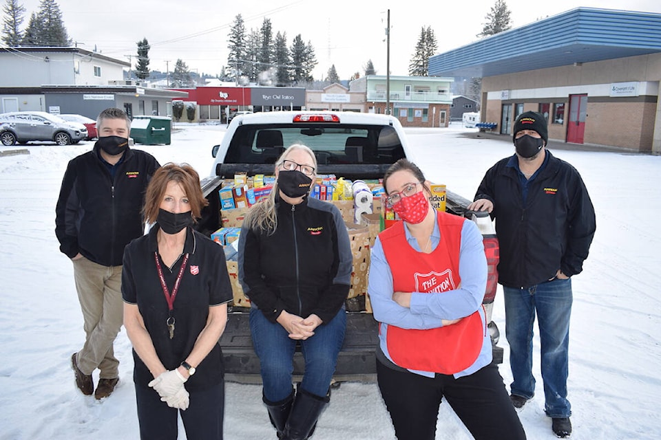 Arrow Transportation delivered more than 800 pounds of food to the Quesnel Salvation Army that resumed services at its Warrior’s Song Cafe on Wednesday, Dec. 8. Helping make the drop-off was Adam Ligerwood (left), Anita Reid (centre) and Steve Williams (right). (Tracey Roberts photo)