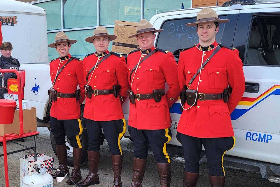 Members of the Quesnel RCMP detachment were dressed in their classic mountie uniform to raise donations for their Stuff a Cruiser Campaign. The department set up outside Save-On-Foods in West Quesnel collecting food, toys and cash for the Quesnel Salvation Army, Seniors Living Society and Big Brothers Big Sisters. (Cassidy Dankochik Photo - Quesnel Cariboo Observer)