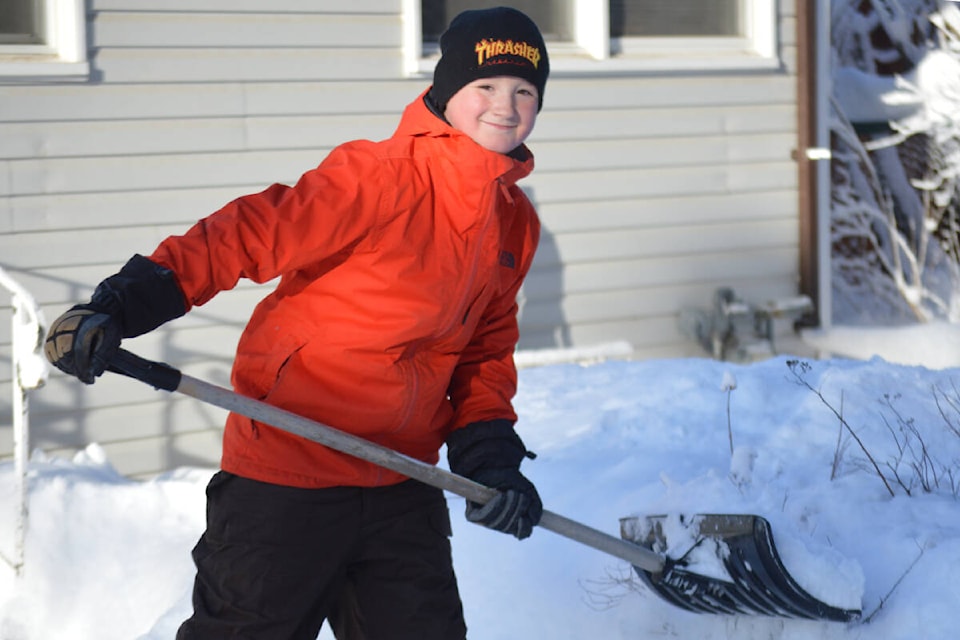 Kashten Wilbur, 12, was busy shovelling snow for seniors in Quesnel on Thursday, Dec. 30. (Rebecca Dyok photo)