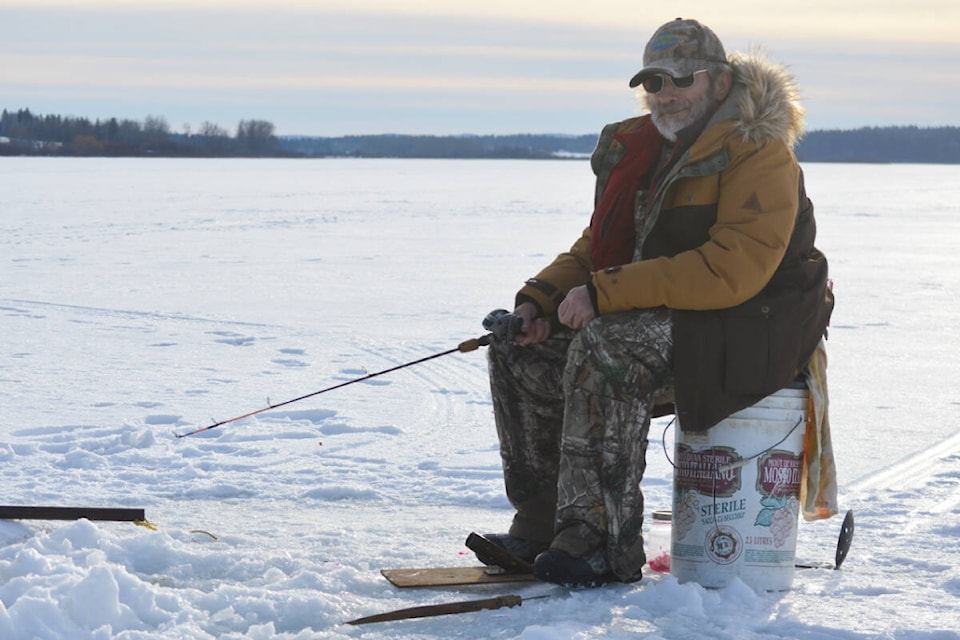 Gary Knoke spent his Sunday afternooon ice fishing on Dragon Lake. (Rebecca Dyok photo)
