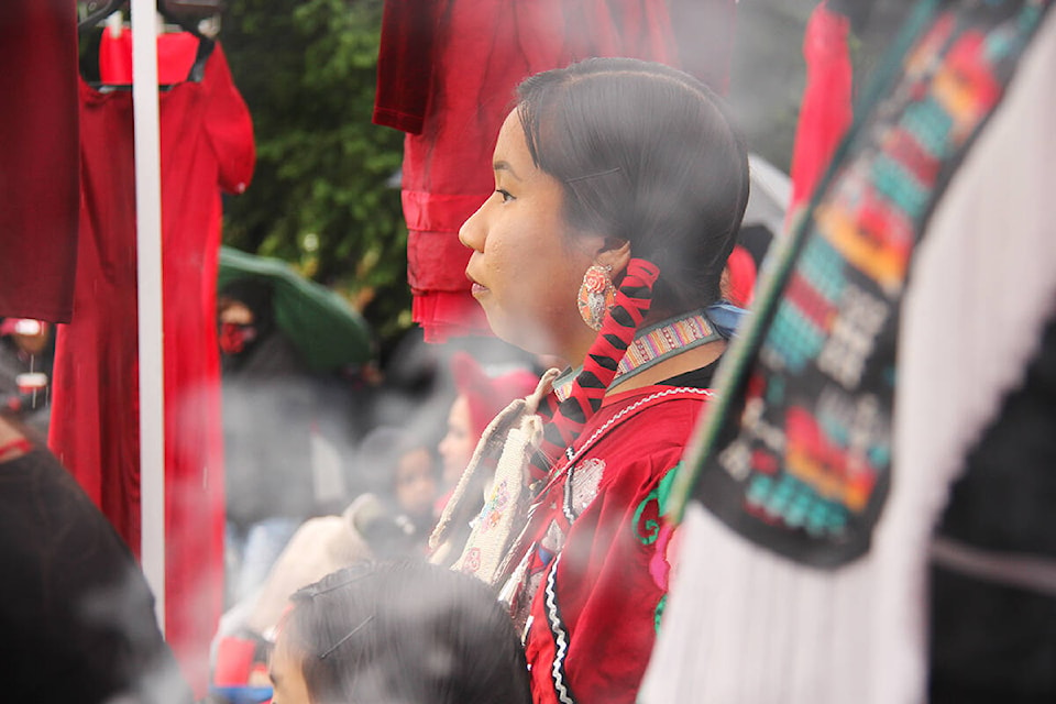 Dozens of people gathered at Vancouver City Hall Thursday (May 5) to mark Red Dress Day and call attention to the continued crisis of missing and murdered Indigenous women, girls and two-spirit people. (Jane Skrypnek/News Staff)