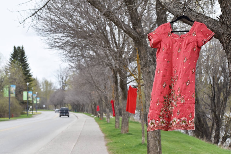 Red dresses were in Quesnel on Thursday, May 5. (Rebecca Dyok photo — Quesnel Cariboo Observer)