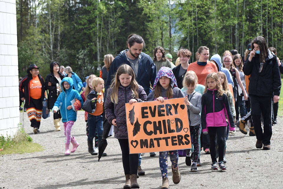 Students from Quesnel Junior School, Lakeview Elementary and École Red Bluff Lhtako Elementary joined up for the first annual 215 Memorial Walk. (Rebecca Dyok photo — Quesnel Observer)