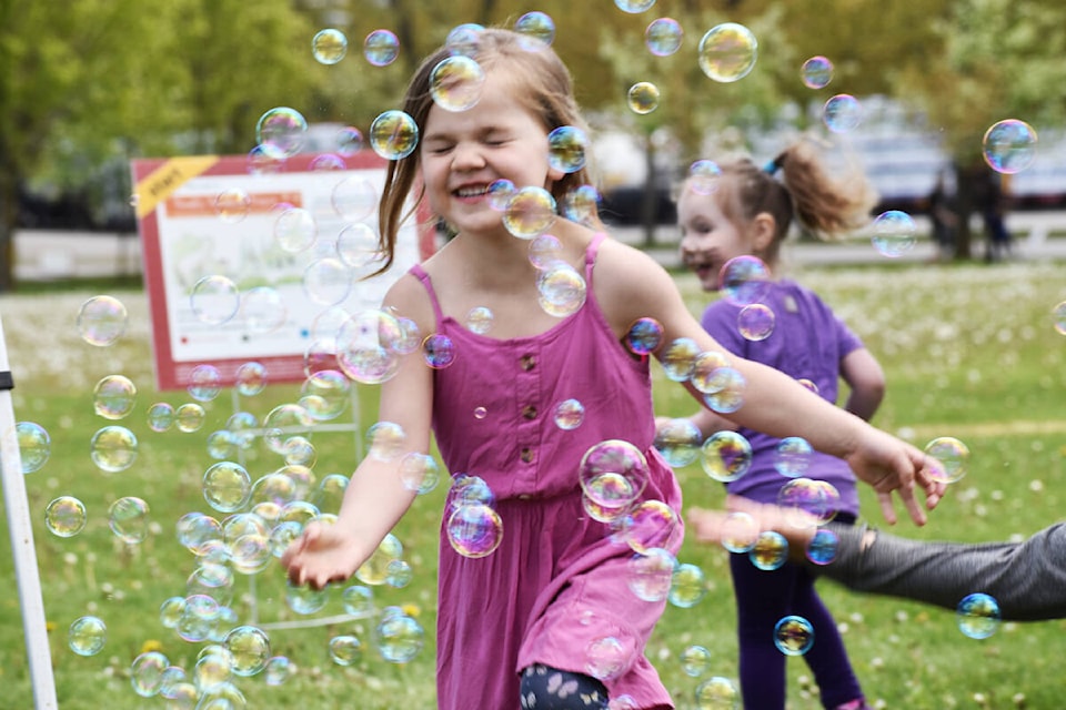 Dottie Entwistle, 4, plays with bubbles at the Quesnel Children’s Festival. (Rebecca Dyok photo — Quesnel Cariboo Observer)