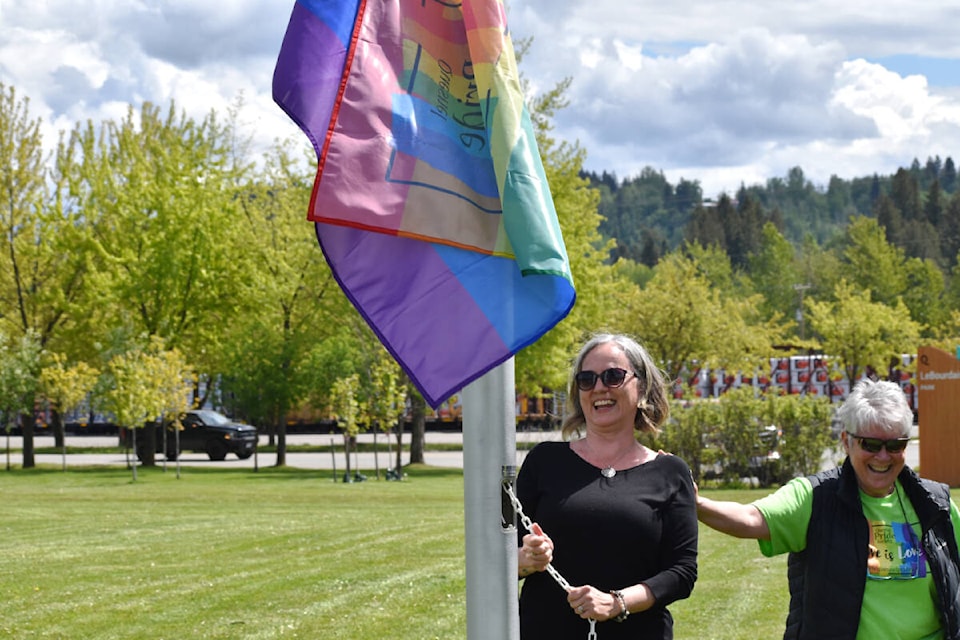 There were cheers and applause after Quesnel Pride Society vice president Sue Hunt helped raise the pride flag on Wednesday, June 1 at LeBourdais Park. (Rebecca Dyok photo — Quesnel Observer)