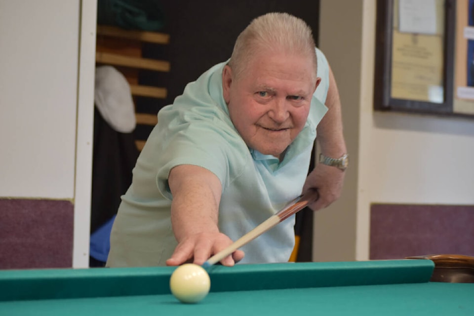 Harry West lines up his shot at the Golden Centre where he enjoyed some afternoon pool Thursday, June 2. (Rebecca Dyok photo — Quesnel Cariboo Observer)