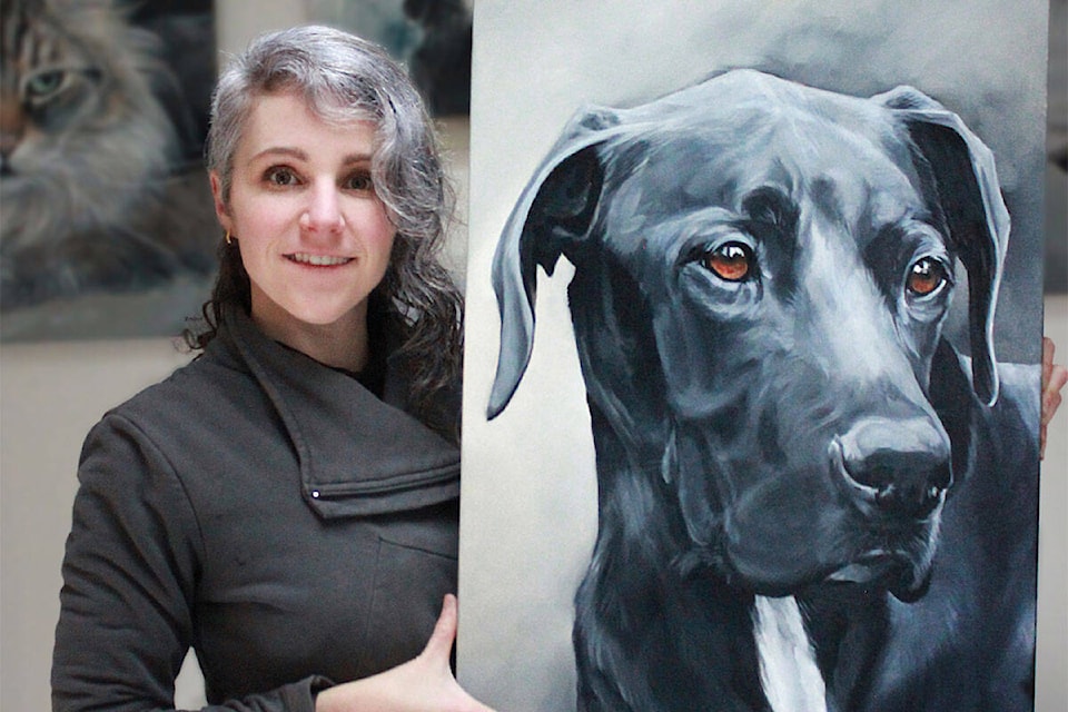 Oil portraitist Zann Hemphill with her painting of a dog named Dexter. (Zann Hemphill/Paws by Zann photo).
