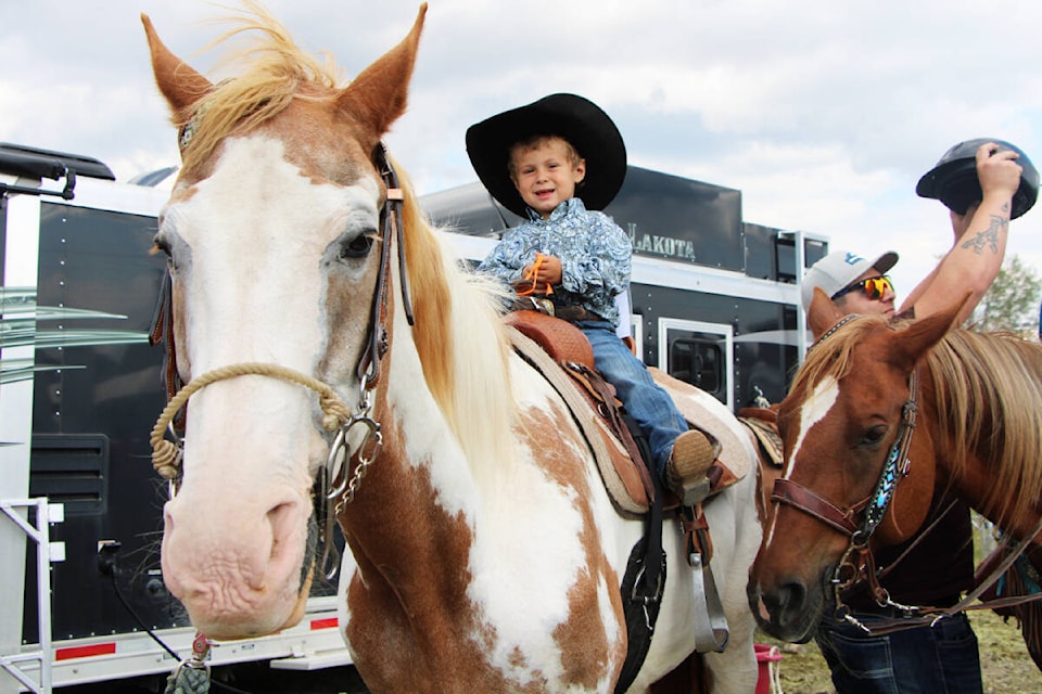 Hunter Mader, 3, sits atop his horse Mick, 33, at the Little Britches Rodeo in 100 Mile House last weekend. (Patrick Davies photo - 100 Mile Free Press)