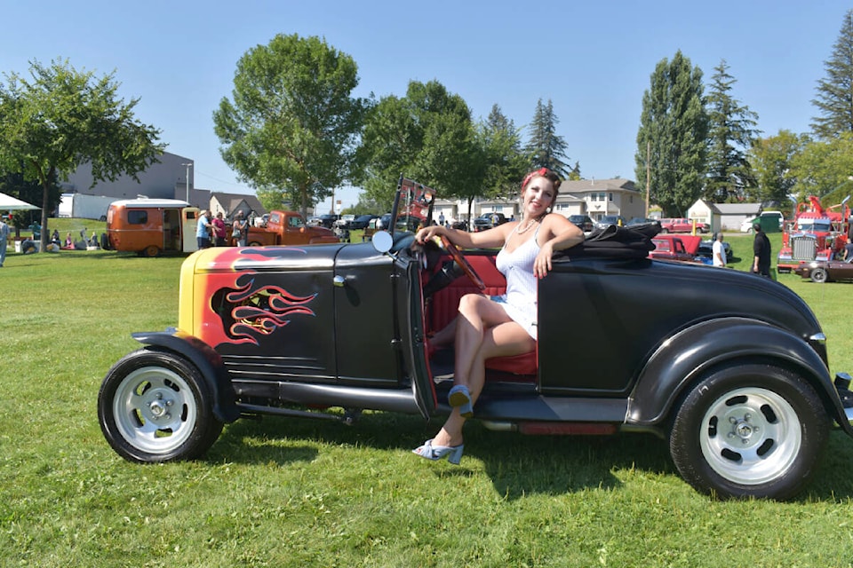 Pin-up girl contest winner and Ford fan Kayden Heinrichs of Prince George poses in a 1931 Ford Roadster owned by Chris Brown of Vanderhoof. (Rebecca Dyok photo — Quesnel Observer)