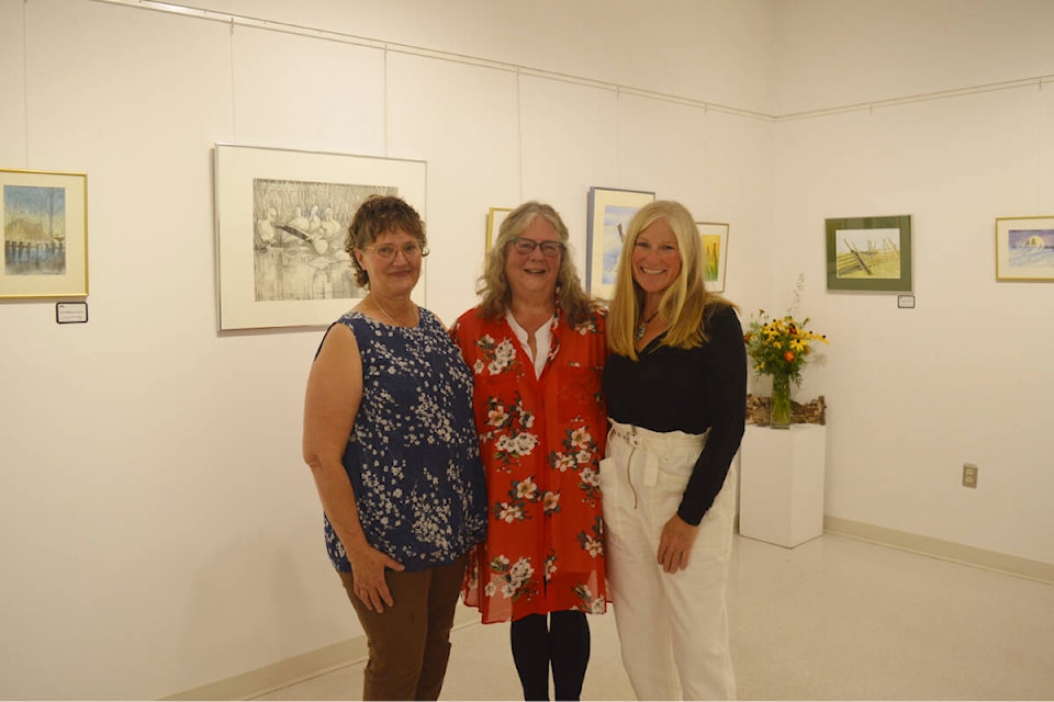 Work by artists and friends Louise McKillican, Maggie Ferguson-Dumais and Denise Wellband is on display at the Quesnel Art Gallery’s latest exhibit ‘Down to the Wire’ (Fences Gates n Country). (Rebecca Dyok photo — Quesnel Observer)