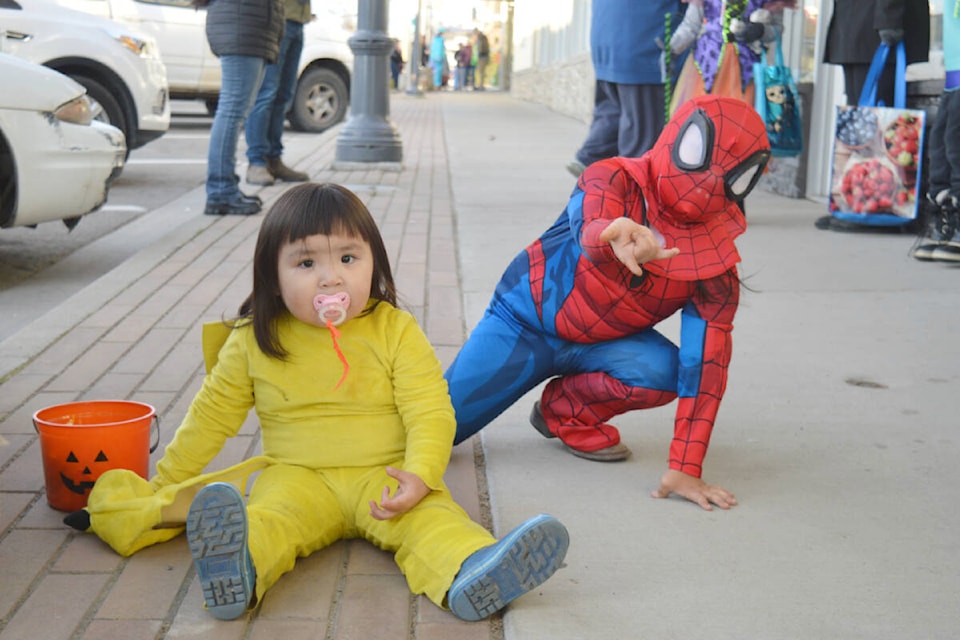 River (left) and Tiberius Sassie weren’t camera shy on the 2022 Halloween Treat Trail. The siblings were dressed as Pikachu and Spider-Man. (Rebecca Dyok photo — Quesnel Observer)