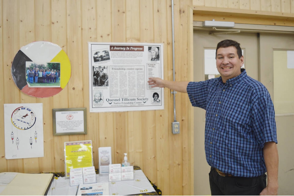 Quesnel Tillicum Society/Native Friendship Centre executive director Tony Goulet points to a December 1974 Observer article on the opening of the centre located at 319 North Fraser Drive. (Rebecca Dyok photo — Quesnel Observer)
