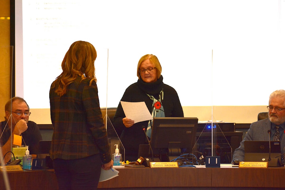 Cariboo Regional District Area H director Margo Wagner is officially sworn in Nov. 10, while Area C director John Massier, right, looks on. Wagner was also acclaimed to remain on as chair. (Monica Lamb-Yorski photo - Williams Lake Tribune