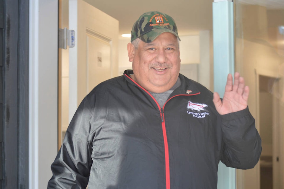 Chief Clifford Lebrun was all smiles during a tour of new on-reserve homes in his community. (Rebecca Dyok photo — Quesnel Observer)