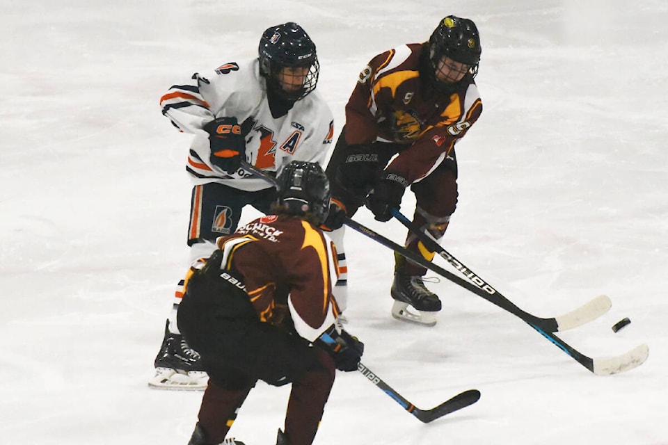 Thunder’s Matt Gerich (right) and another teammate defends against a Kamloops forward at a Jan. 27-29 tournament in Williams Lake. (Angie Mindus photos - Quesnel Observer)