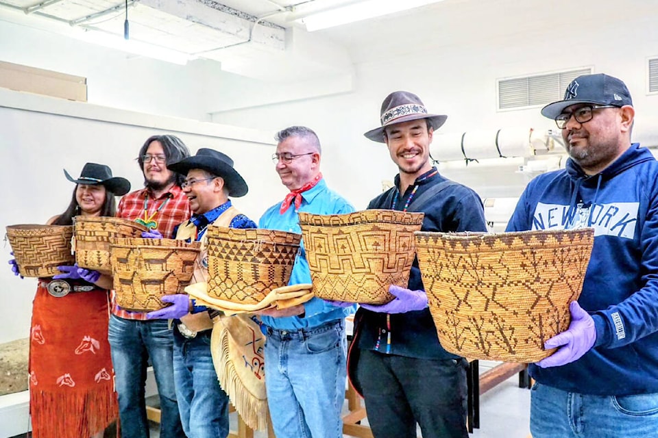 A delegation from the Tsilhqot’in National Government visited Tsilhqot’in baskets at the Brooklyn Museum while in New York in April. Michole Jane Meyers, from left, Dalton Baptiste, Roger William, Francis Laceese, Trevor Mack and James Lulua Jr. hold the baskets. (Tsilhqot’in National Government photo)