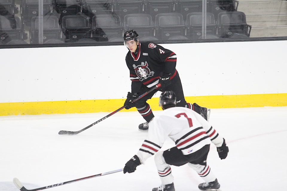 Red Deer Rebels defenceman Luke Vlooswyk looks for a pass during the teams black and white game on Tuesday evening at the Peavey Mart Centrium.