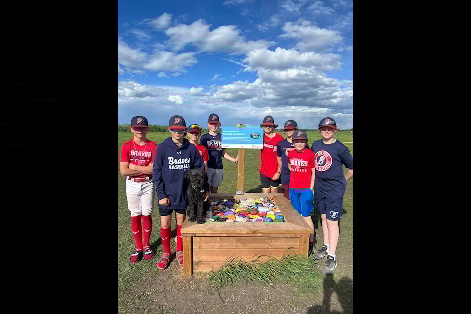 Players with the 13U AA1 Red Deer Northstar Braves have already contributed rocks to SPARC Red Deer's new Kindness Rock Garden at Oxbows Dog Park. (Photo from Red Deer Minor Baseball on Facebook)