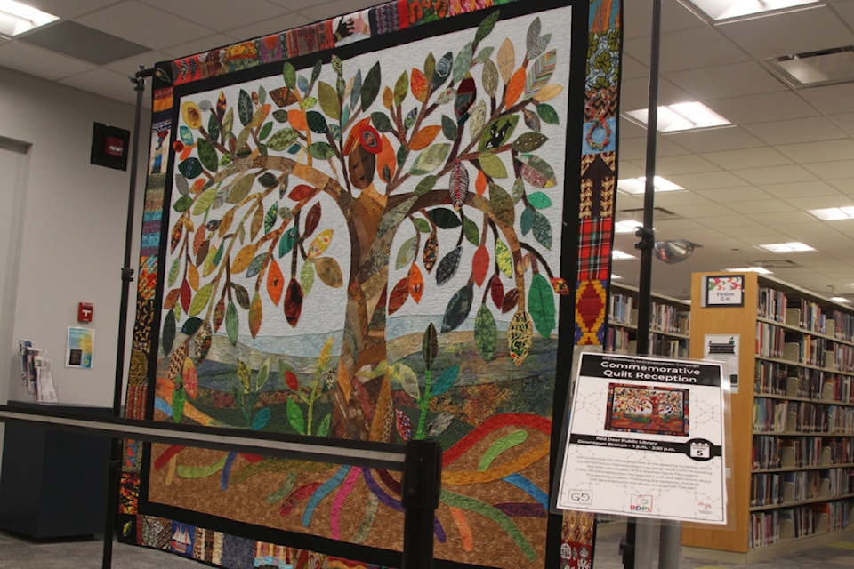 The Grandmothers to Grandmothers Campaign quilt is on display at the Red Deer Public Library's downtown branch. (Photo by Sean McIntosh/Advocate staff)