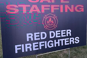 Lawn signs popping up in support of Red Deer firefighters