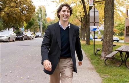 Liberal candidate Justin Trudeau laughs after visiting a polling station in his Papineau riding of Montreal
