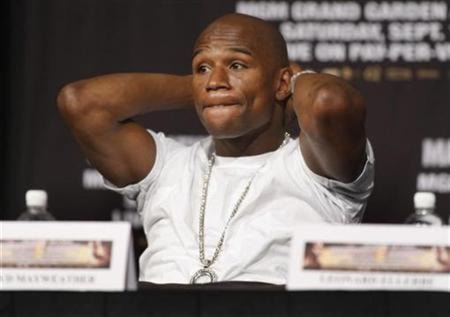 Boxer Floyd Mayweather Jr. of the U.S. gestures during a news conference at the MGM Grand hotel-casino in Las Vegas