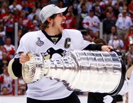 Penguins captain Crosby celebrates while hoisting the Stanley Cup in Detroit