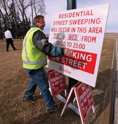 A02-streetSweepingSign