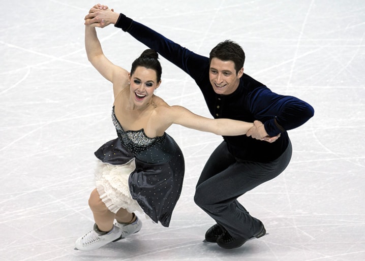 Tessa Virtue and Scott Moir of Canada perform in the ice dance short program as the World Figure Skating Championships in London