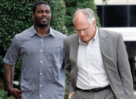 Michael Vick, Larry Woodward