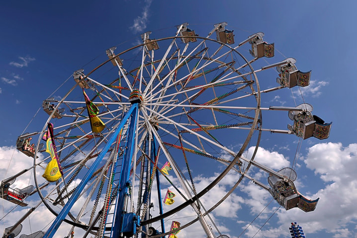 People can ride in a large Ferris Wheel on the midway during Westerner Days.
