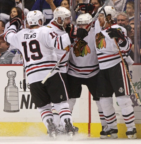 Jonathan Toews, Troy Brouwer, Patrick Kane Brian Campbell