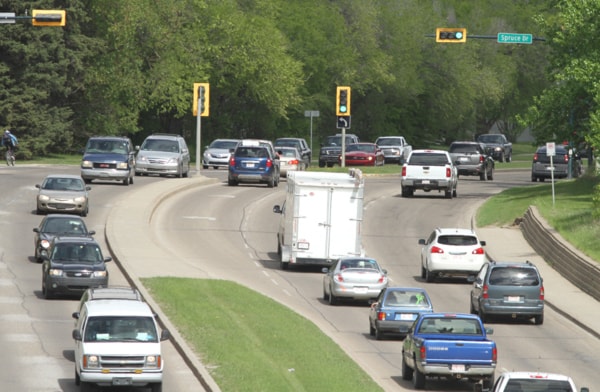 Afternoon traffic makes its way along 32nd Street at Spruce Drive.