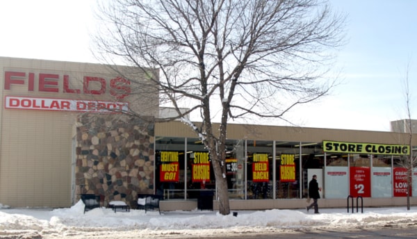 Pedestrians walk past the Fields Dollar Depot in downtown Red Deer.