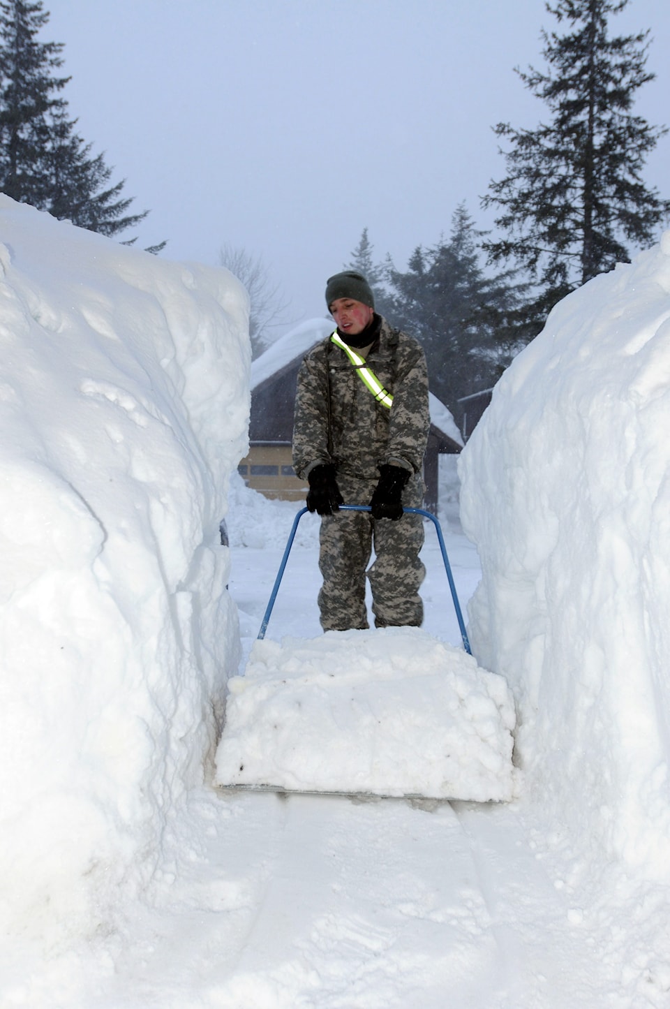 Alaska National Guardsman Clears Snow