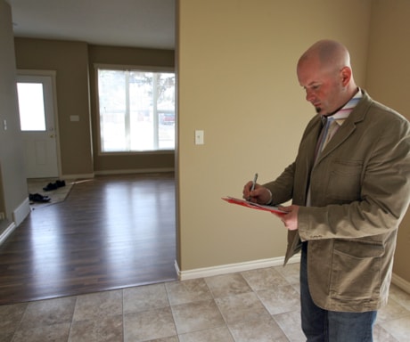 Todd Wyatt of Rescue Realty assesses a home in Lacombe.