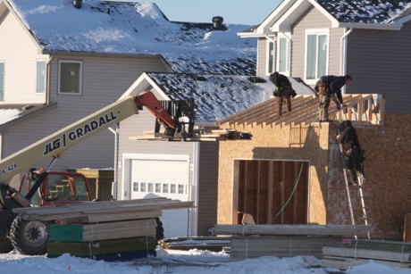 A framing crew works on a new home in Timberstone Park Tuesday.
