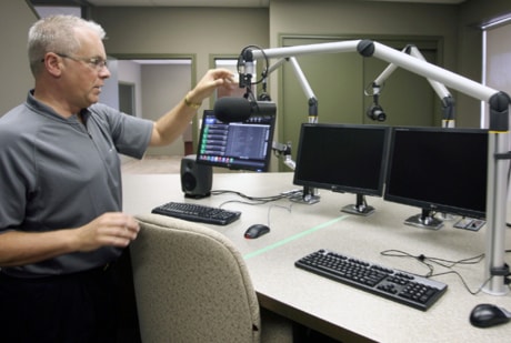 Manager Daryl Holien checks out his radio station’s new control room Monday.