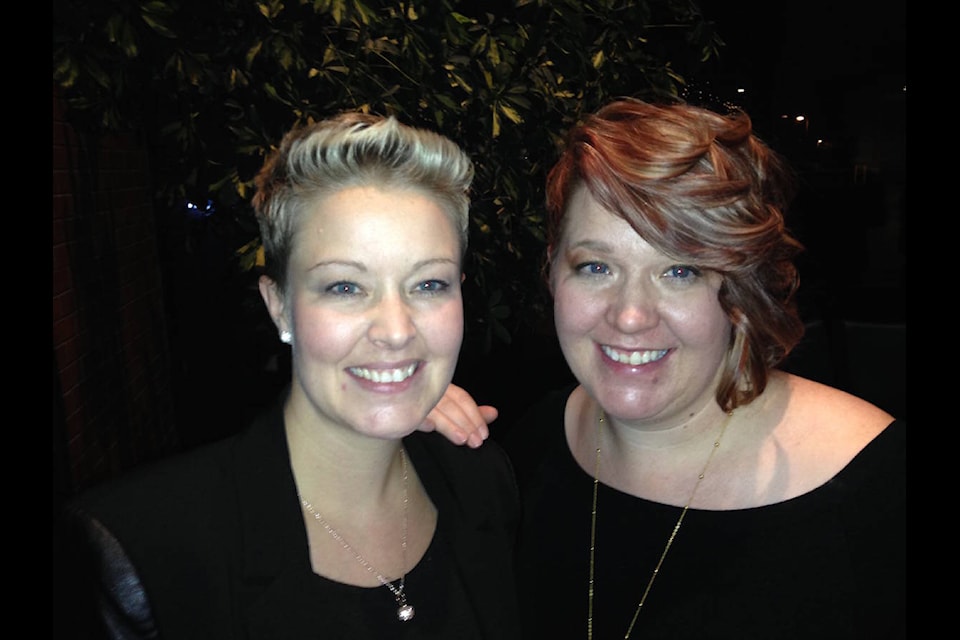 Sisters Sheena Johnson (left) and Cortney Hollenga won Business of the Year Award for companies with 10 or fewer employees at the Red Deer and District Chamber of Commerce annual event on Wednesday.