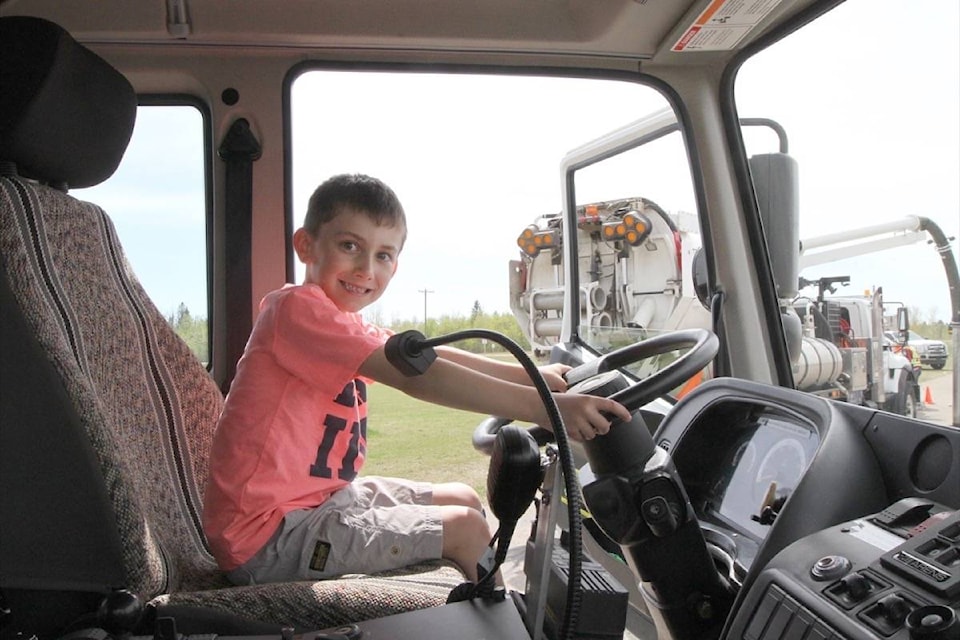 Red Deer’s Seth Banwarth, 6, sits in a city street sweeper during the Central Alberta Crime Prevention Centre’s third annual Touch-A-Truck event at the Crossroads Church Saturday. (Photo by SEAN MCINTOSH/Advocate staff)