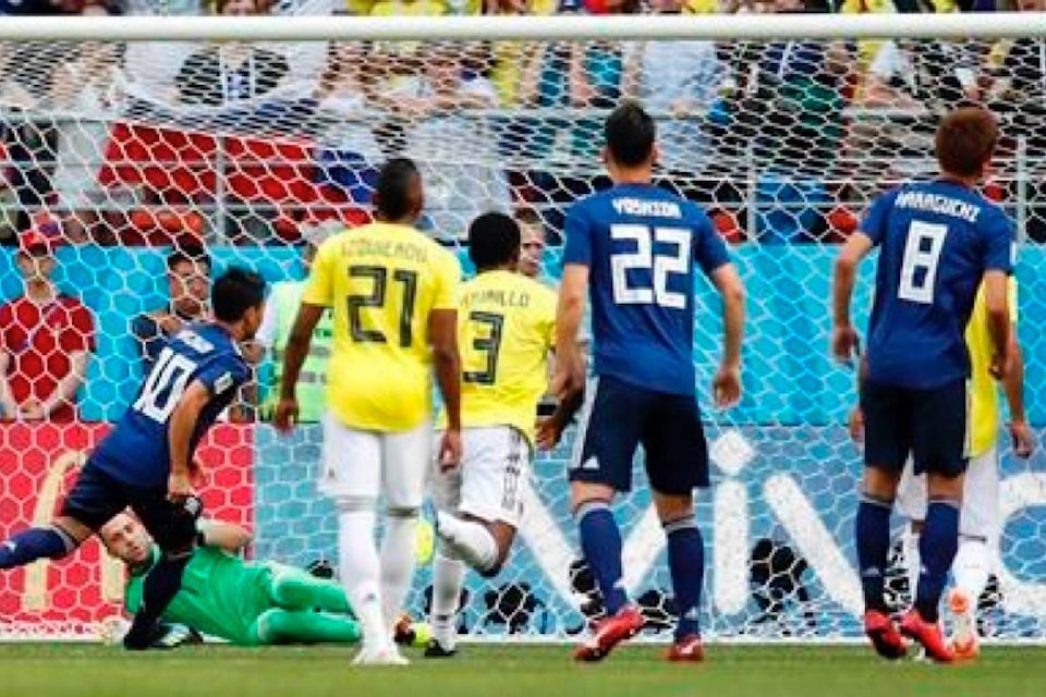 12378034_web1_180619-RDA-Japan-tops-Colombia-2-1-in-latest-World-Cup-surprise_1