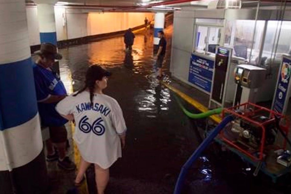 13054466_web1_180808-RDA-Close-call-for-two-men-in-flooded-elevator-during-heavy-rain-in-Toronto_2