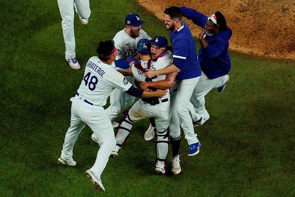 23149819_web1_201028-RDA-Fitting-finale-Dodgers-win-title-Turner-tests-positive-baseball_1