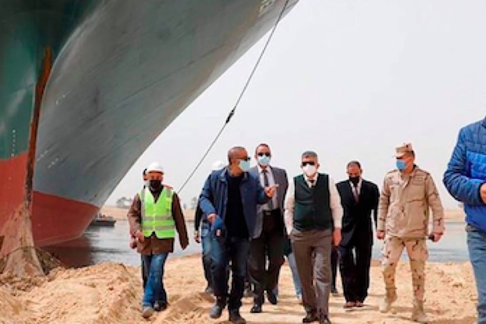 24649346_web1_210326-RDA-Egyp-traces-to-dislodge-giant-vessel-blocking-Suez-Canal-canal_1