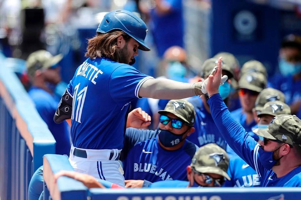 25218698_web1_210519-RDA-Jays-in-flight-in-AL-East-despite-injuries-home-field-changes-and-tough-schedule-baseball_1