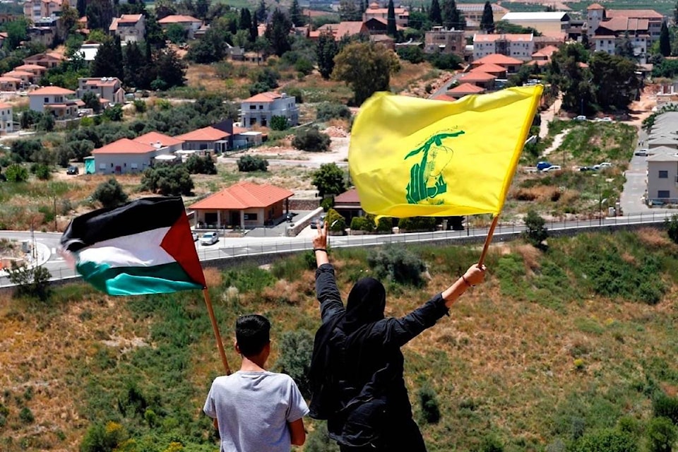 25246436_web1_210521-RDA-On-the-sidelines-Hezbollah-looms-large-over-Gaza-battle-gaza_1