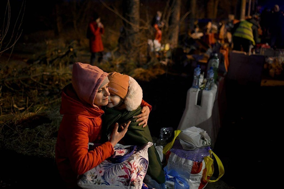 28291095_web1_220226-RDA-Ukrainians-flee-war-seeking-safety-across-western-borders-ukraine_1