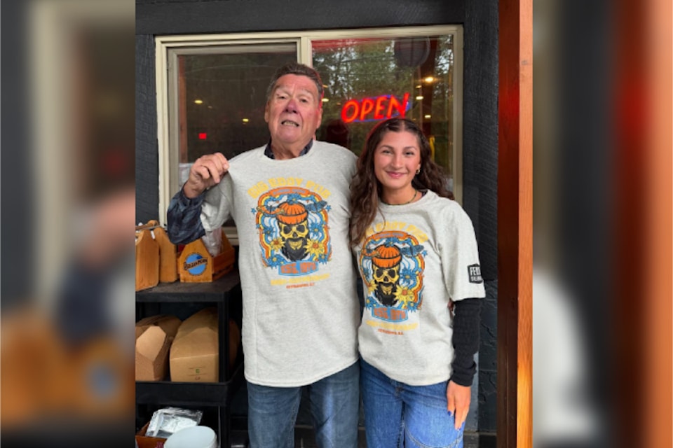 Revelstokians sport the Big Eddy Pub's custom T-shirts for its 50th-anniversary celebration Aug. 9, 2025.