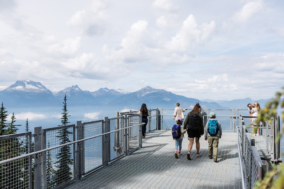 Visitors admire the Monashee Mountains from the Revelstoke Highline, which opens at Revelstoke Mountain Resort at the top of Revelation Gondola on Friday, Aug. 22.