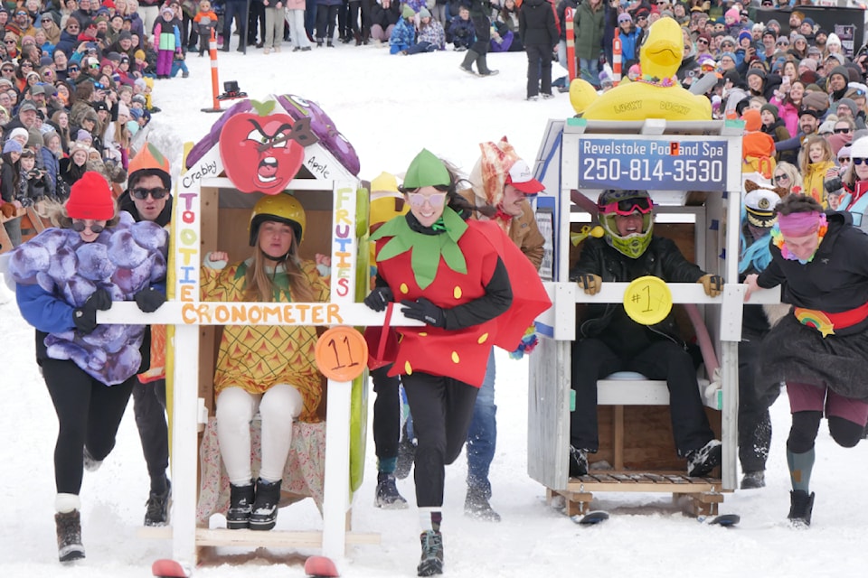 Local service providers compete at the 101st Revelstoke Winter Carnival's Saturday afternoon outhouse race event at Centennial Park, Feb. 15.